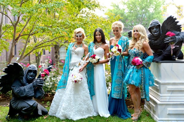 Gargoyles posing with bridal party